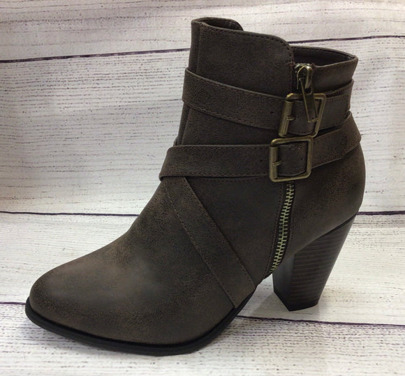 Cross strapped brown boots
