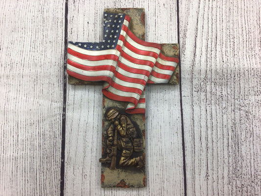 Soldier Kneeling and Flag Cross